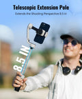 Man using CQ5 Combo 3-Axis Phone Gimbal With AI Face Tracking Fill Light and telescopic pole outdoors.