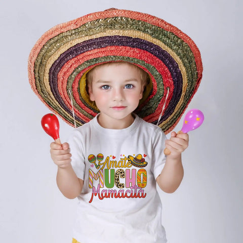Child in sombrero with maracas wearing Cinco de Mayo themed t-shirt for DIY crafts and festive apparel