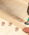 50 Piece Wood Hole Plugs Set For Furniture And Cabinet Woodwork Repair shown covering screws on wooden furniture.