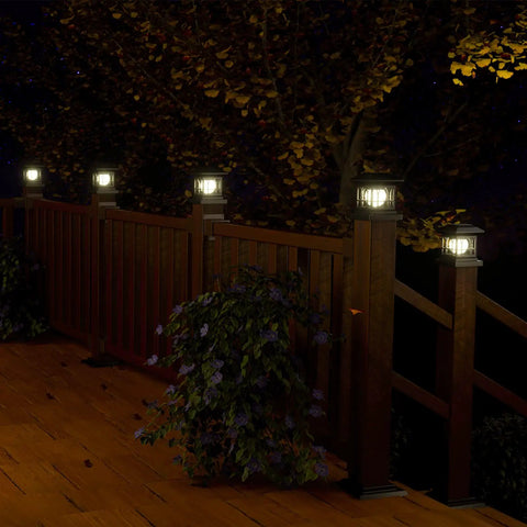 Go-To LED Post Cap Lights For Outdoor Wood Fence And Decks Fits 3.5 By 3.5 4 By 4 4.5 By 4.5 And 5 By 5 Posts glowing on fence at night