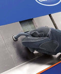 Gloved hand adjusting 48 Inch Pan And Box Sheet Metal Brake With Adjustable Removable Fingers for precise 135 degree bends and versatility.