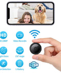 Ultra Compact WiFi Spy Camera With Remote Monitoring Night Vision, showing child and dog on smartphone display, hand holding camera.