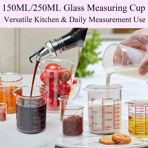 Seven Piece Glass Measuring Cup Set With Borosilicate Beaker Style Nesting Cups, Clear Markings From 1 Tsp To 8 Oz, Your Kitchen Go To For Baking, Cooking And Drink Prep, Durable Glass Easy To Read. 150ml and 250ml glass measuring cups in use