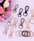 50Pcs 5 Colors Push Gate Snap Hooks With Key Rings Kit For Lanyards Handbags DIY Crafts of assorted sizes and colors on display