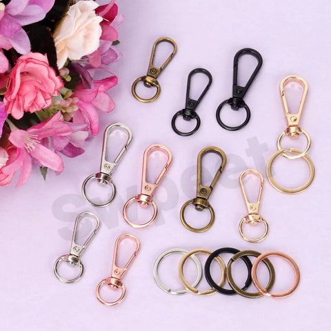 50Pcs 5 Colors Push Gate Snap Hooks With Key Rings Kit For Lanyards Handbags DIY Crafts of assorted sizes and colors on display