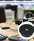 Two Pack 1 1/4 Inch Black Rubber Cable Grommets For Desks organizing messy wires on a desk, covering wire holes flexibly.
