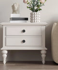 White dresser with 18 Pack Black Cabinet Knobs Zinc Alloy Round Drawer Knob 1-5/8 Inch, two drawers, plant on top