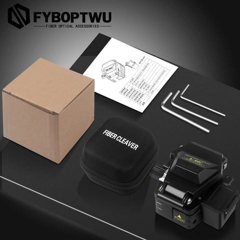 Three In One FTTH Fiber Cleaver with Auto Scrap Collector, tools, case, and packaging on a black surface.