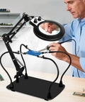 Helping Hands Soldering Station With 10X Magnifier Light And Stand Magnetic Third Hand Tool in use for PCB repair.