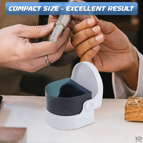 Cordless Jewelry And Denture Cleaner portable white unit with open dark basin, shown compact size for rings and dentures