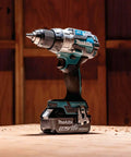 Kickin Amp 18V Brushless Cordless Drill Driver with metal chuck, battery-powered, designed for construction and heavy use.