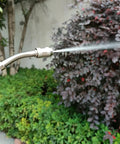 Universal Stainless Steel Sprayer Wand With Shut Off Valve 29 Inch Garden Watering And Car Wash Kit in use spraying plants