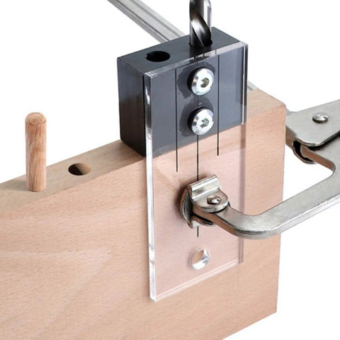 Rock Solid One Quarter Inch Dowel Drilling Jig Kit With Hardened Steel Bore Guides And Clear Acrylic Base showing dowel alignment on wood.