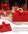 Valentine Day Candy Boxes With Handles Pack Of 20 Portable Paper Wrapping Boxes for parties, adorned with a red bow on table.