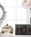 Vintage jewelry box with Retro Mini Iron Hinge Set With Screws For Jewelry Boxes And Small Wooden Cases beside mirror and flowers