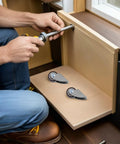 Installing Fixed Caster Wheels Inch 6pcs Rubber for Furniture and Carts on wooden drawer with tools in hand.