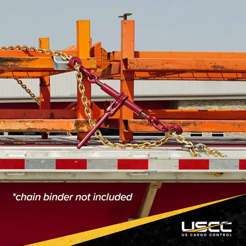 Heavy Duty Grade 70 Transport Chain 550 Foot Bulk Drum secured on flatbed trailer with chain binder and orange cargo equipment