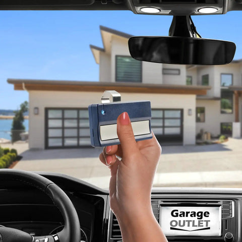 Hand holding Navy Blue Universal Garage Door Opener Remote For LiftMaster 971LM 390MHz inside car, facing garage