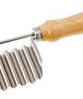 Vegetable crinkle cutter and French fry slicer with wooden handle and stainless steel blade.