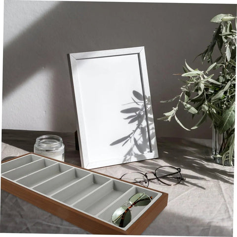 Slick Wooden Sunglasses Display Plate Featuring Seven Grid Slots For Eyeglasses Organization on a neutral surface with glasses.