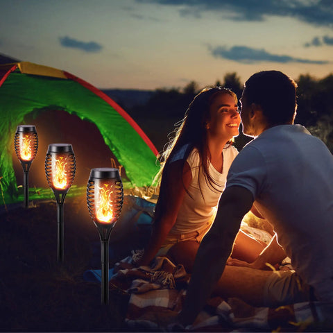 Couple camping near Six Pack Solar Torch Lights With Realistic Flickering Flame Dope Waterproof Outdoor Landscape Pathway Lights