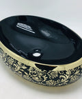 This Sleek Oval Ceramic Vessel Sink Totally Kicks Up Your Bath Game With A Premium Matte Gold Countertop Basin Delivering A Dreamy High Style Look And Super Easy Cleaning Surfaces. Black and gold ceramic basin with smooth surface.