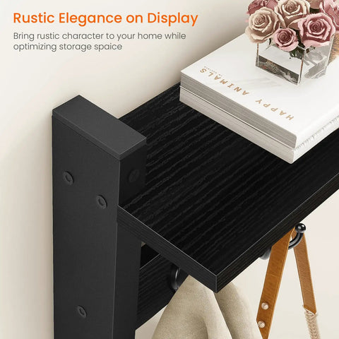 Coat Rack With Shelf And Tri Hooks Wall Mounted 24 Inch Wooden Hanging Coat Hanger For Entryway Bathroom Mudroom And Bedroom Black Finish With Stable Iron Frame For Everyday Use showing top view with books and flowers.