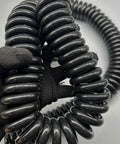 Heavy Duty Flexible Coiled Extension Cord Featuring A Rock Solid Spiral Build That Expands To Sixty Feet, shown in close-up.