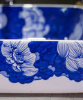 Top Shelf Rectangular Ceramic Vessel Sink With Slick Hand Painted Blue Finish For Above Counter Vanity Setup detailed view of floral design.