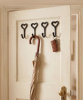 12 Pack Heavy Duty Cast Iron Coat Hooks Wall Mounted Black Workhorse Wall Storage For Coats Bags Built Tough For The Daily Grind With A Sleek Flat Black Finish That Lasts In Any Room on a door with an umbrella and key holder.
