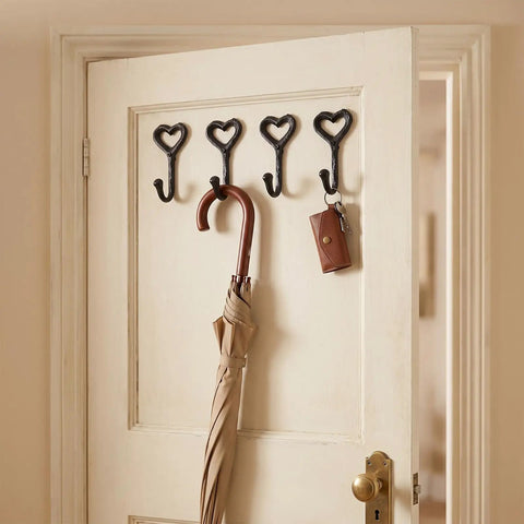 12 Pack Heavy Duty Cast Iron Coat Hooks Wall Mounted Black Workhorse Wall Storage For Coats Bags Built Tough For The Daily Grind With A Sleek Flat Black Finish That Lasts In Any Room on a door with an umbrella and key holder.