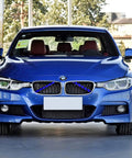 BMW with Grille Insert Trim Covers V Brace Wrap and Blue Grill Stripes, front view