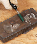 120 Grit Zirconia Sanding Bands For Detail Work Set on metal surface with rotary tool in use