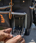 Detail of Heavy Duty Tool Bag With Shoulder Strap And 40 Pockets In Bright Orange Interior For Fast Tool Access, Molded Bottom For Stability