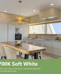 Modern kitchen with natural light, featuring wooden dining table and 2700K soft white LED lighting for warm ambiance.