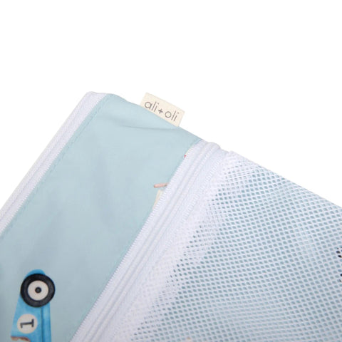 Close-up of wet dry bag for baby gear with dual compartments, featuring a blue fabric and white mesh zippered section.