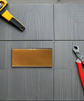 Awesome 4 PCS Golden Welding Helmet Glass Filter Lens replacement on gray wood surface with tools.