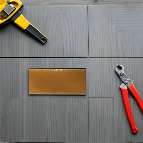 Awesome 4 PCS Golden Welding Helmet Glass Filter Lens replacement on gray wood surface with tools.