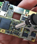 110V Portable Heat Gun For Desoldering And Soldering With Adjustable Air Flow And Temperature in use on a PCB for electronics repair.
