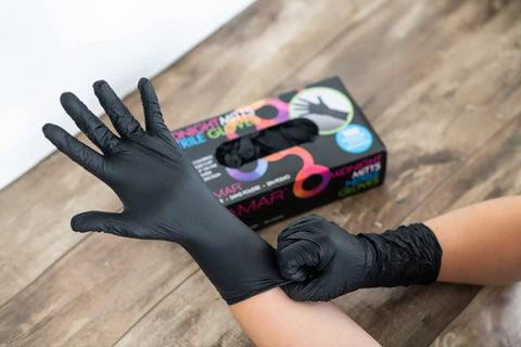 Person wearing Powder Free Nitrile Gloves 12 Inch Pro Grade Extra Durable Black Disposable Latex Free For Hair Dye Cleaning Tattoo Treatments