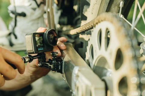 Premium Flat And Curved Surface Action Camera Mounts Featuring Industrial Strength Adhesive That Sticks Like Crazy And Grips Tough Under Pressure Direct Heat Application For Clean Peel Off attached to a bike frame.