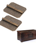 Antique Brass Hinge For Cabinets And Furniture Vintage Engraved Pattern Butt Hinges displayed with wooden chest