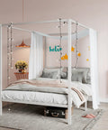 Full Size Canopy Bed Frame with Heavy Duty Metal Slats in White Four-Poster Style with string lights and pillows.