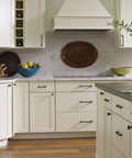 Modern kitchen with Beefy Satin Nickel 12 Inch Center To Center Appliance Pulls on paneled cabinets and large drawers.
