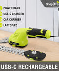Cordless 2-In-1 Hedge Trimmer And Grass Shears With 180 Degree Rotating Head Lightweight 7.2V Handheld Electric Tool 2Ah Battery Plus USB-C Charging, shown with USB-C charging setup on desk.