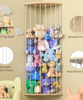 Wood Corner Stuffed Animal Storage Organizer With Star Pattern Adjustable Hanging Toy Shelf for nursery, filled with toys.