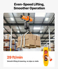 Heavy Duty 2200 Lbs Electric Chain Hoist With 10 Ft Lift, 120V Single Phase Motor lifting boxes at 29 ft/min in a warehouse.