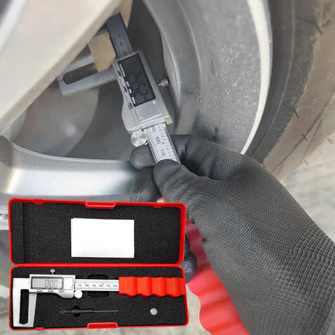 Digital Disc Brake Rotor Caliper with Large LCD Screen in use measuring brake rotor size, with red storage box visible.