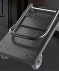 Heavy Duty Foldable Platform Trolley With Smooth As Butter Eight Inch Rubber Wheels And Trustworthy Parking Brake For No Sweat Setup Beast Mode Sack Truck Hauling, close-up of the frame and wheels.