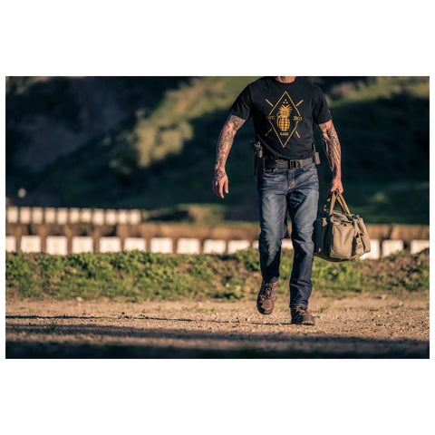 Person walking outdoors wearing Beefy 1.5 Inch Nylon Tactical Belt With Stainless Steel Buckle Converts To Tie Down Or Harness Heavy Duty